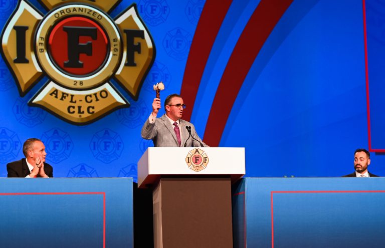 IAFF Man at podium with Gavel