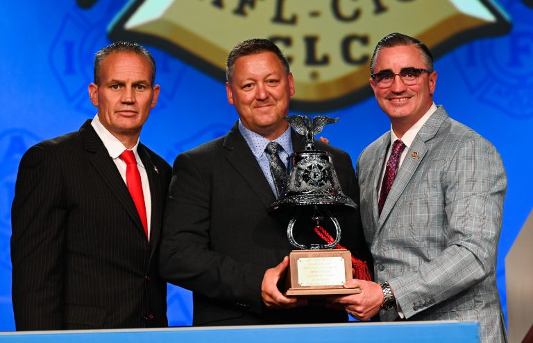 3 men with trophy