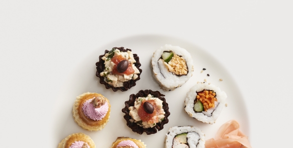 A selection of Hors d'Oeuvres served on a plate.