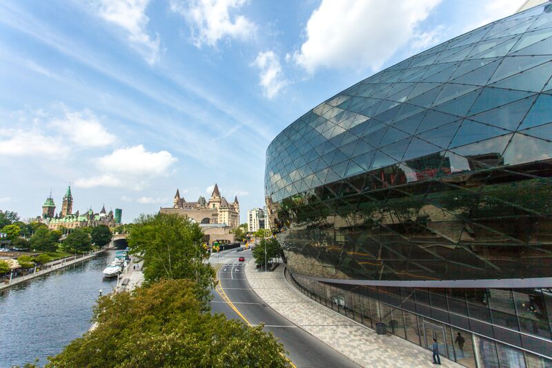 The Shaw Centre overlooks the Rideau Canal at midday.