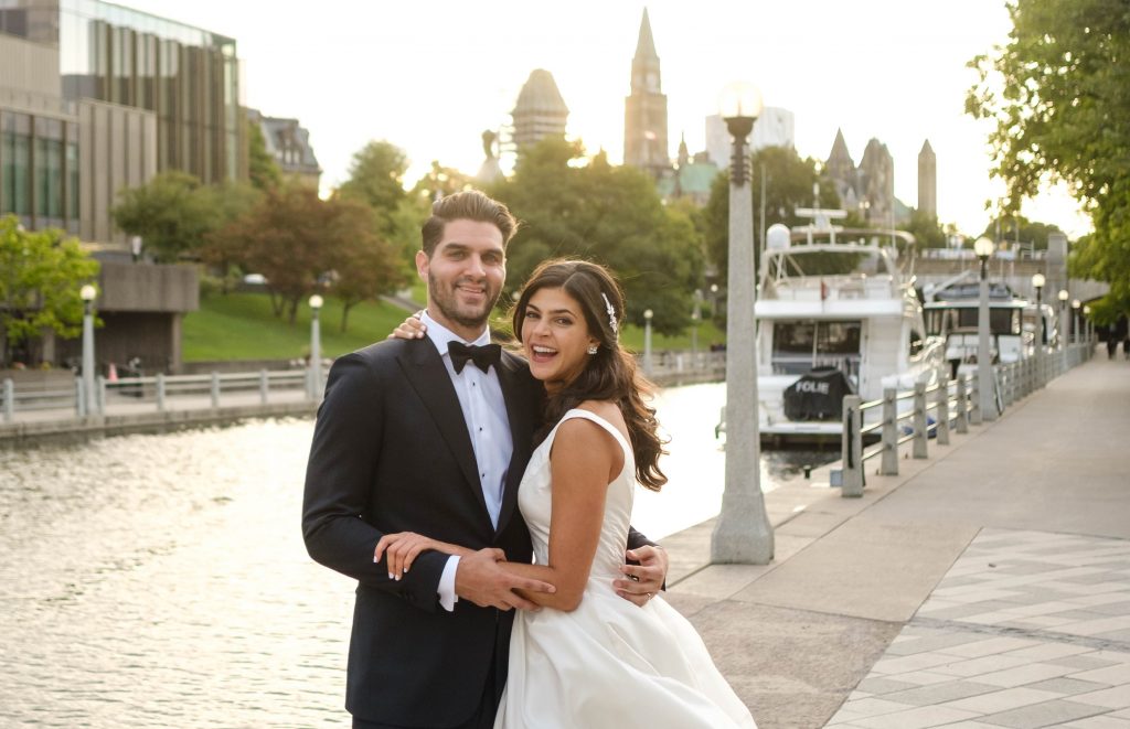 couple standing along water