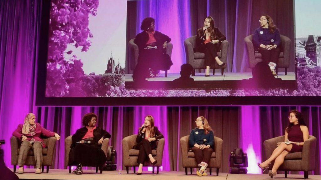 five women speakers on stage
