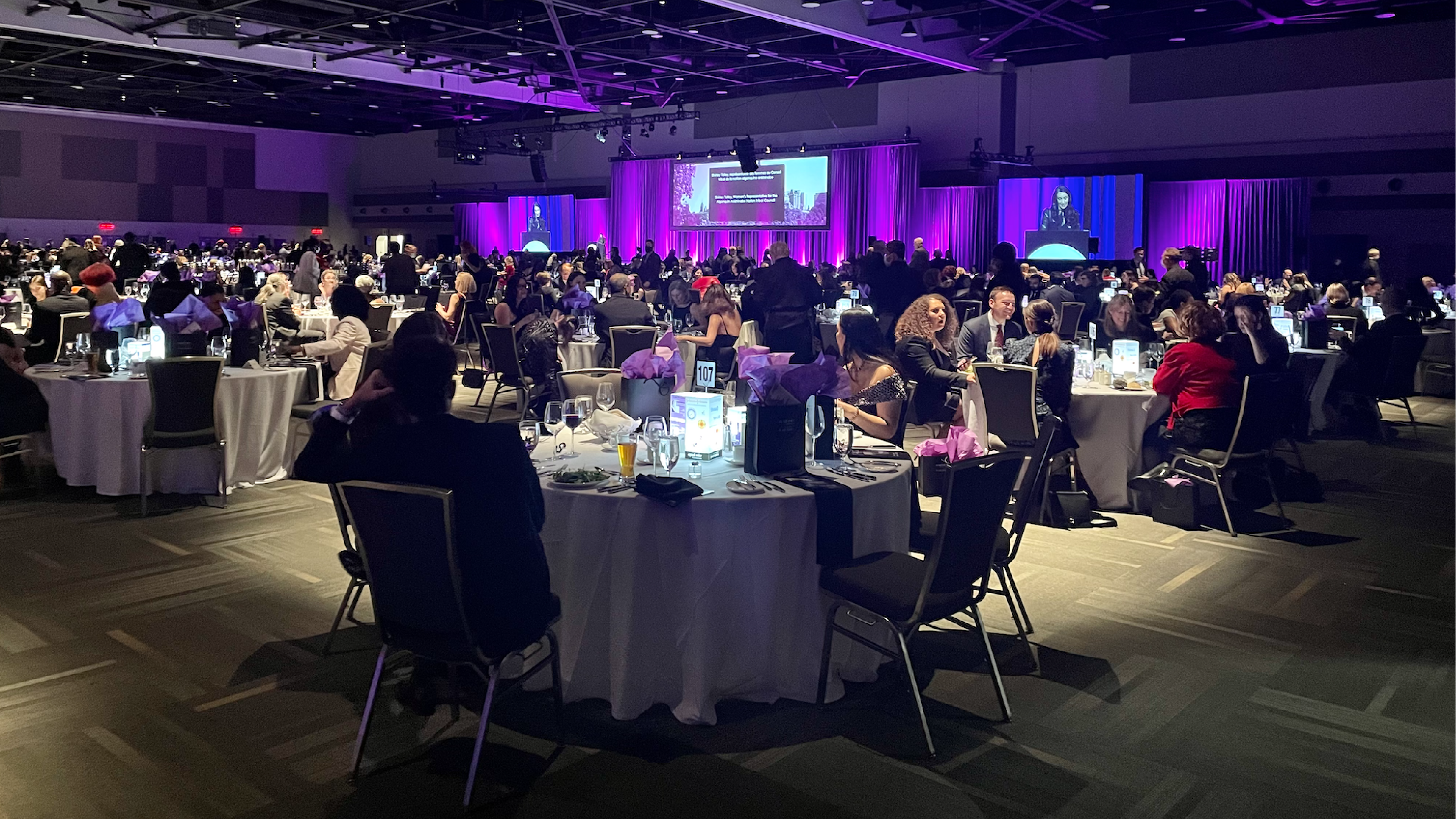 conference attendees eating at round tables