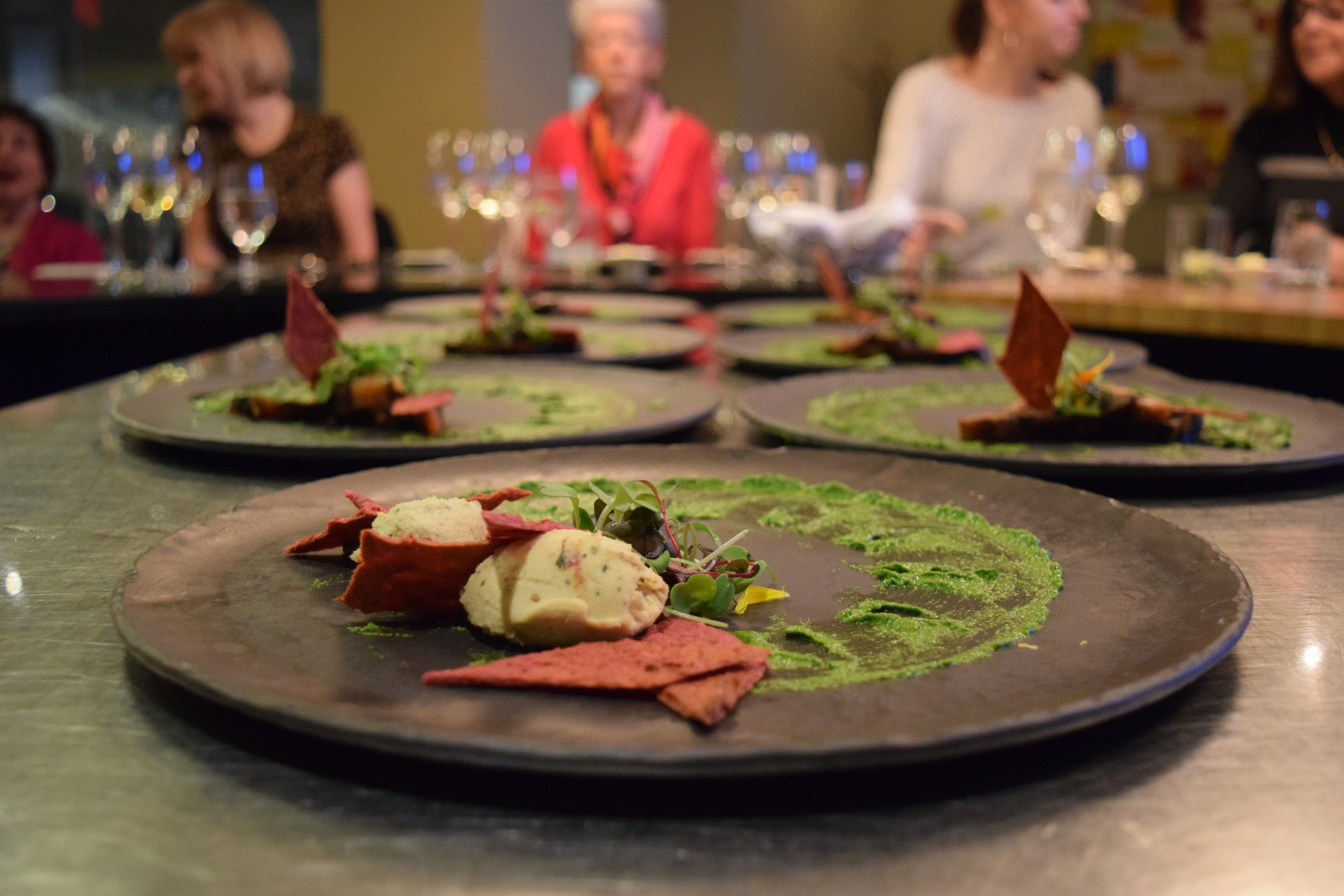 Dinner Dish with attendees in the background