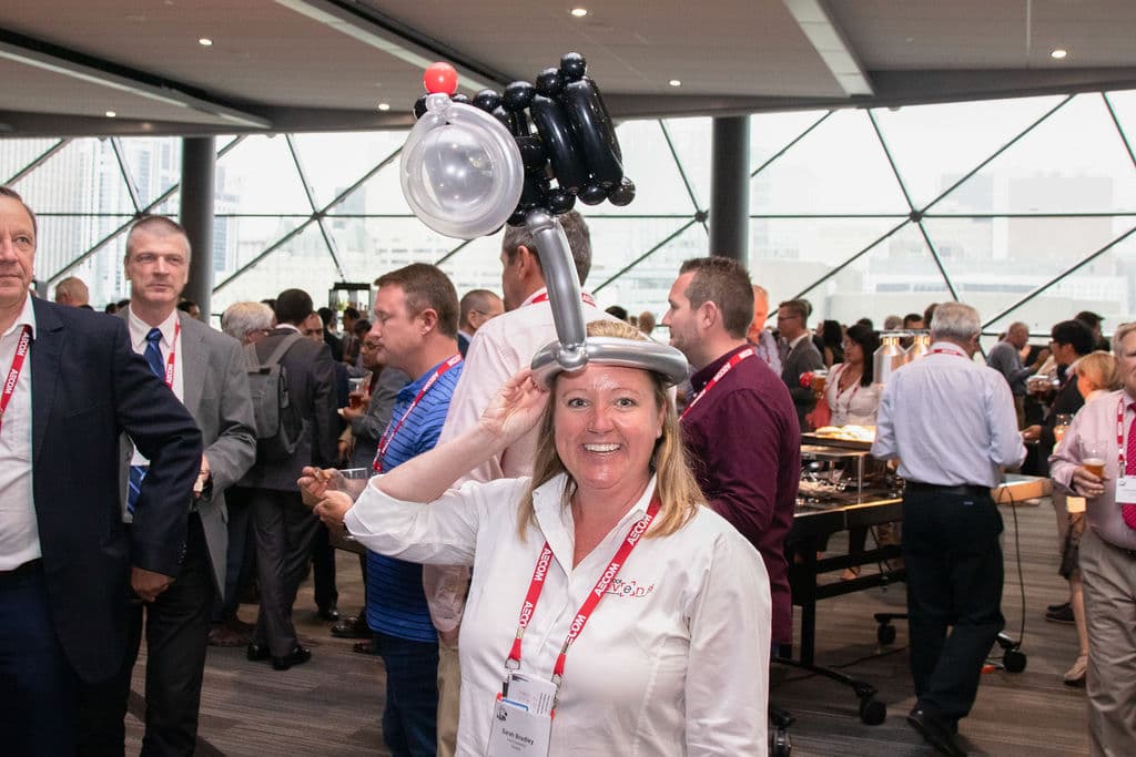 Sarah Bradley from IshootEvents with a balloon hat on smiling at the camera