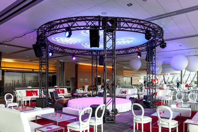 Parliament Foyer trussing & lounges white furniture with red touches such as pillows and candles