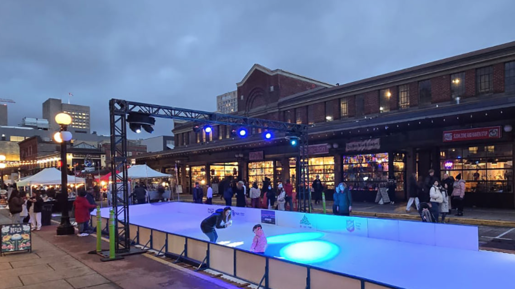 Byward Market Skating Rink 2 skaters and some blue lights