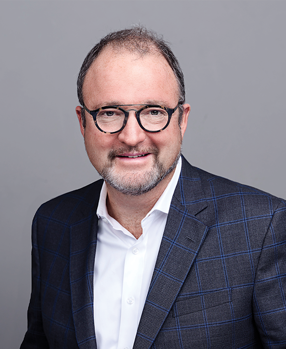 headshot of male in suit